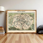 a large framed map of Paris, France, with a wooden frame and a vintage style.