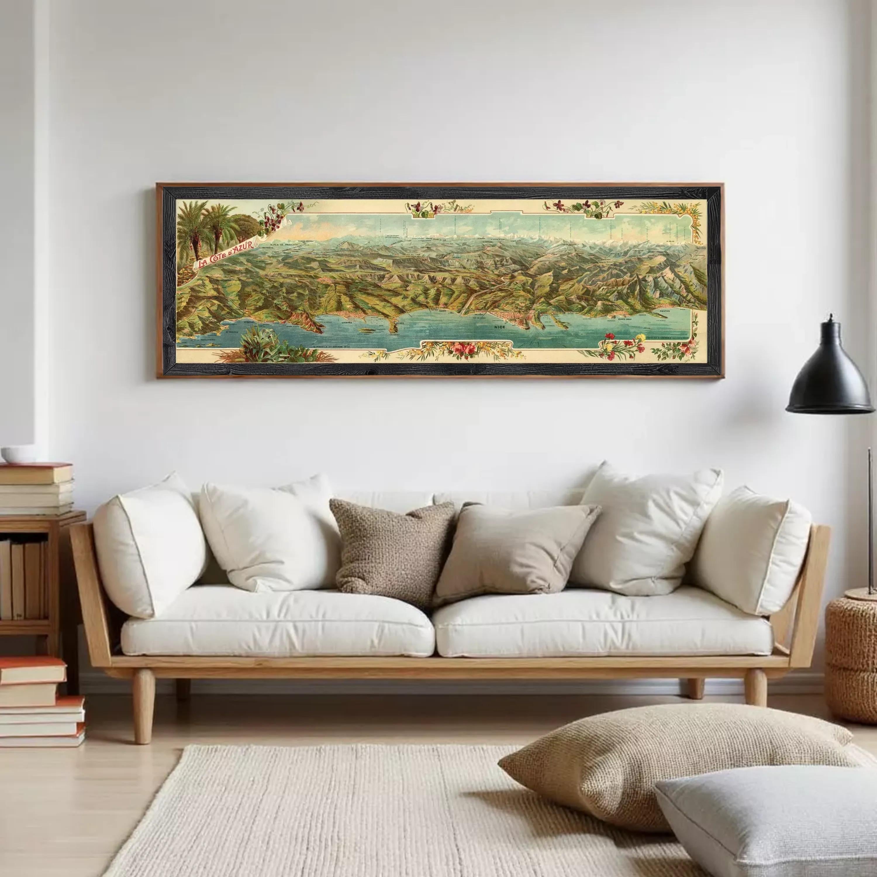 A framed vintage map of a mountainous region, featuring a detailed landscape with various geographical features and a body of water.