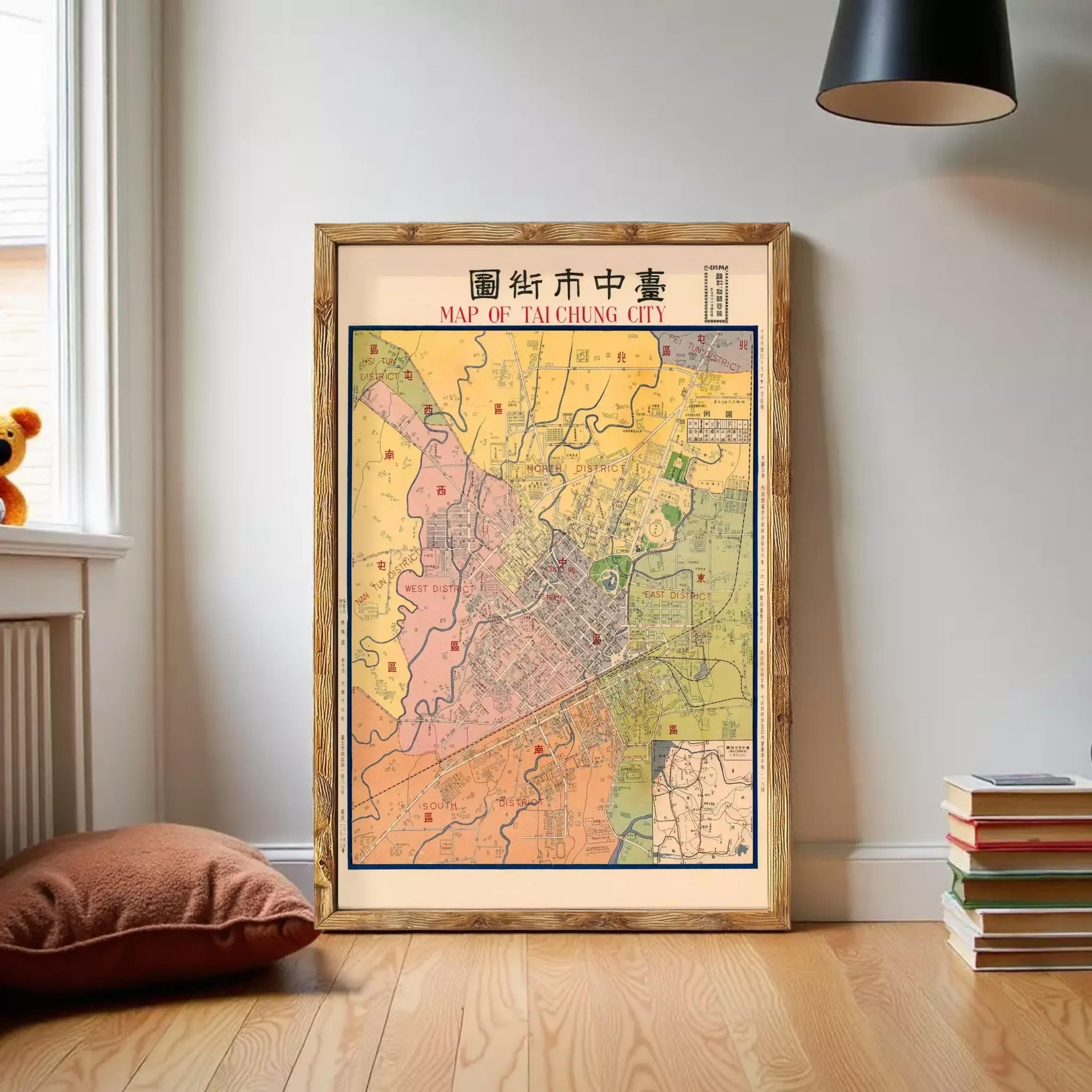 A framed map of Taipei, Taiwan, displayed on a wall in a room.