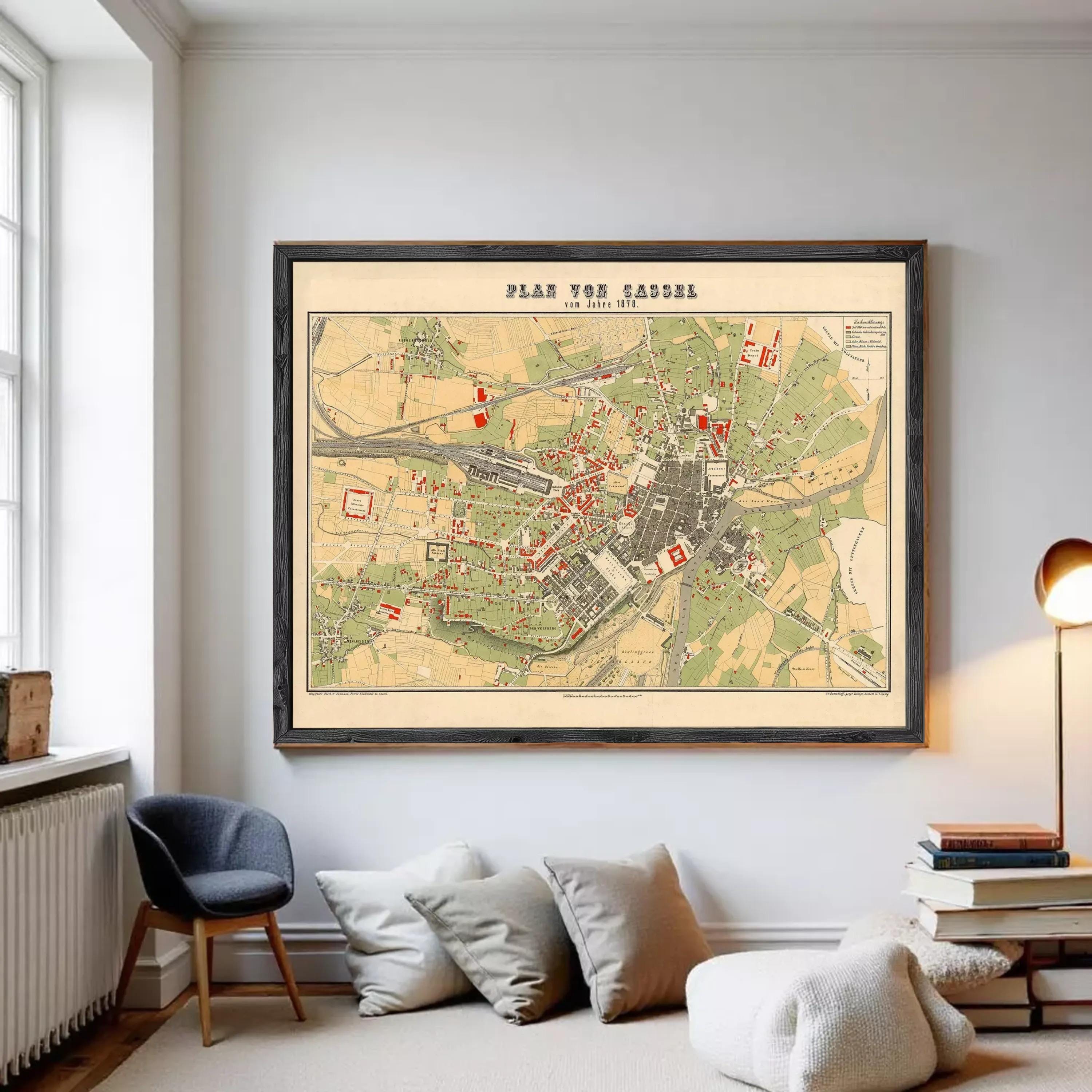 The image is a framed vintage map of a city, depicting various landmarks and streets.
