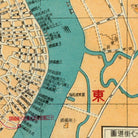 The image is a map of a city, showing streets, buildings, and a river. The map includes various labels and symbols, such as a red Chinese character, indicating the location of a specific place or landmark.