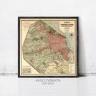 The image is a framed vintage map of a city, likely from the early 20th century, with a focus on the urban layout and surrounding areas.