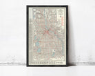 The image is a framed map of Minneapolis, Minnesota, with a detailed layout of the city's streets, landmarks, and other geographic features.