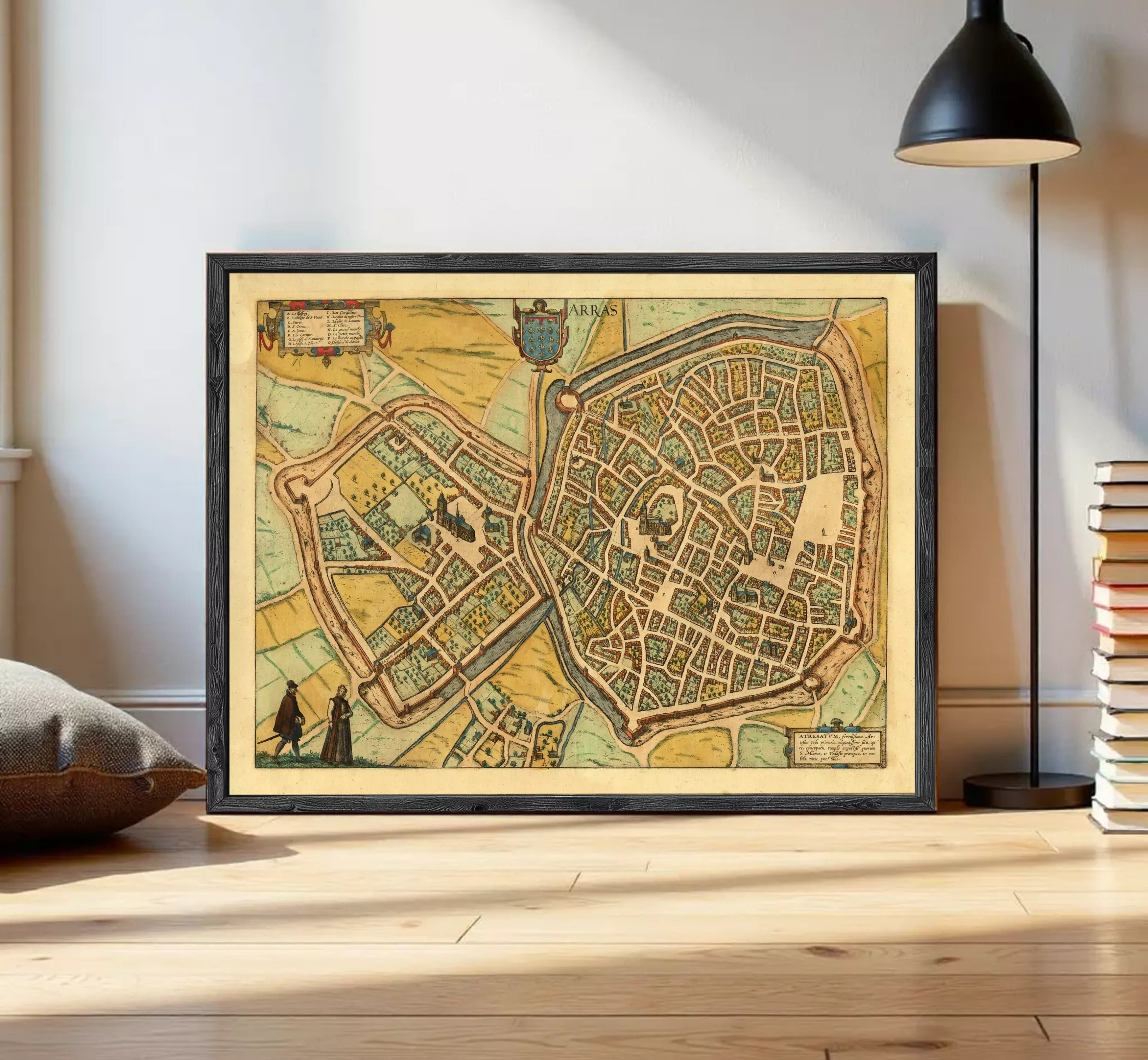 The image is a framed vintage map of a city, depicting a detailed layout of streets, buildings, and other urban features.