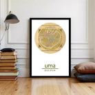 A framed vintage map of Lima, Peru, displayed on a wall in a room with a stack of books and pillows.