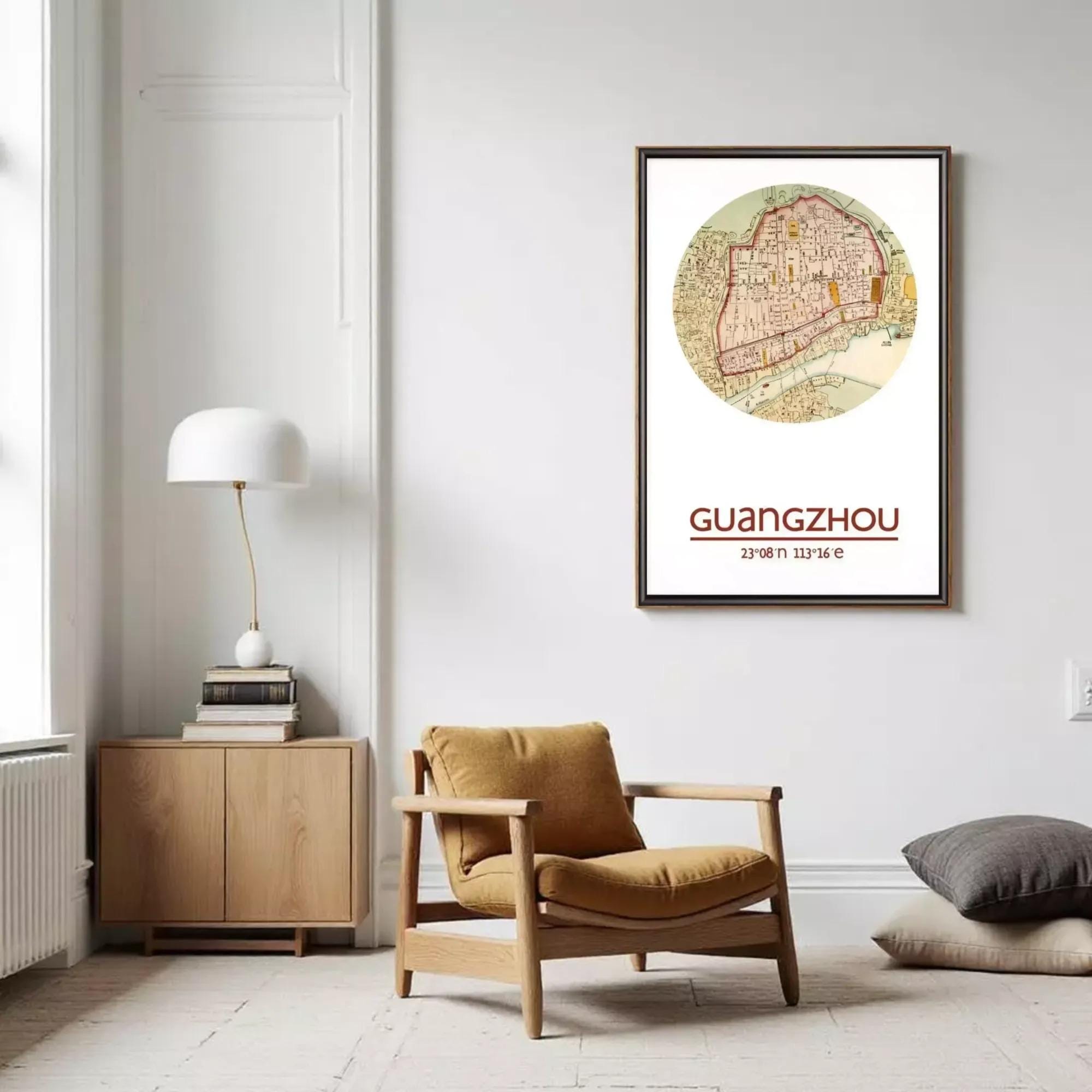 a cozy living room with a wooden chair, a lamp, and a framed map of Guangzhou hanging on the wall.
