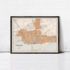 The image is a framed map of Toronto, Canada, depicting the city's streets and surrounding areas.