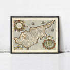 The image is a framed vintage map of the island of Cyprus, depicting the country's geographical layout and surrounding areas.