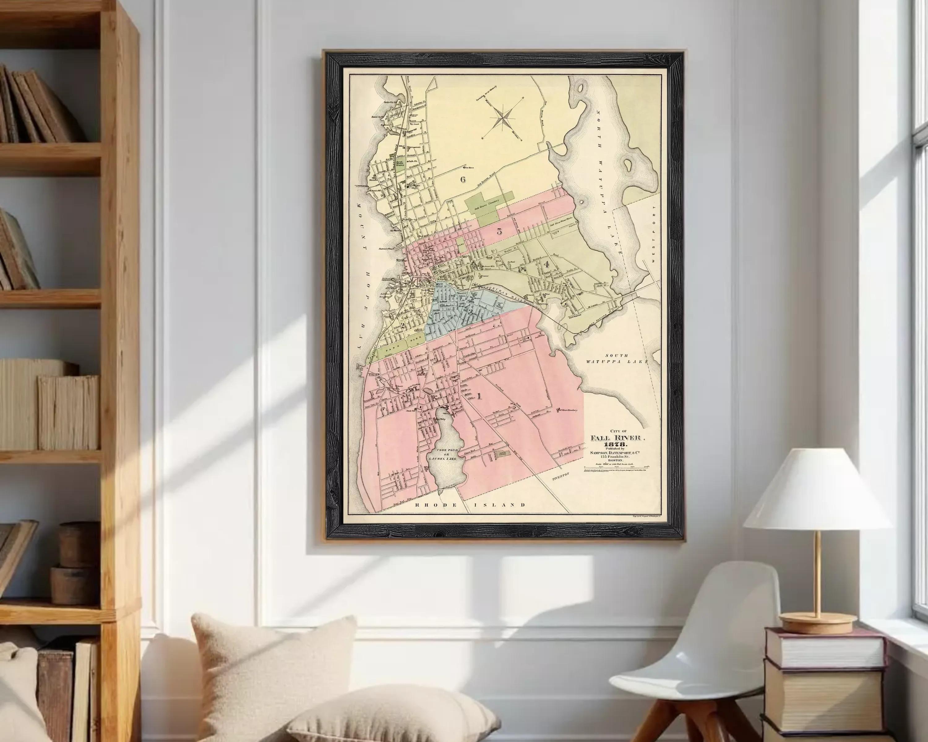 The image is a framed vintage map of a city, likely from the late 19th century, depicting the layout and boundaries of the city.