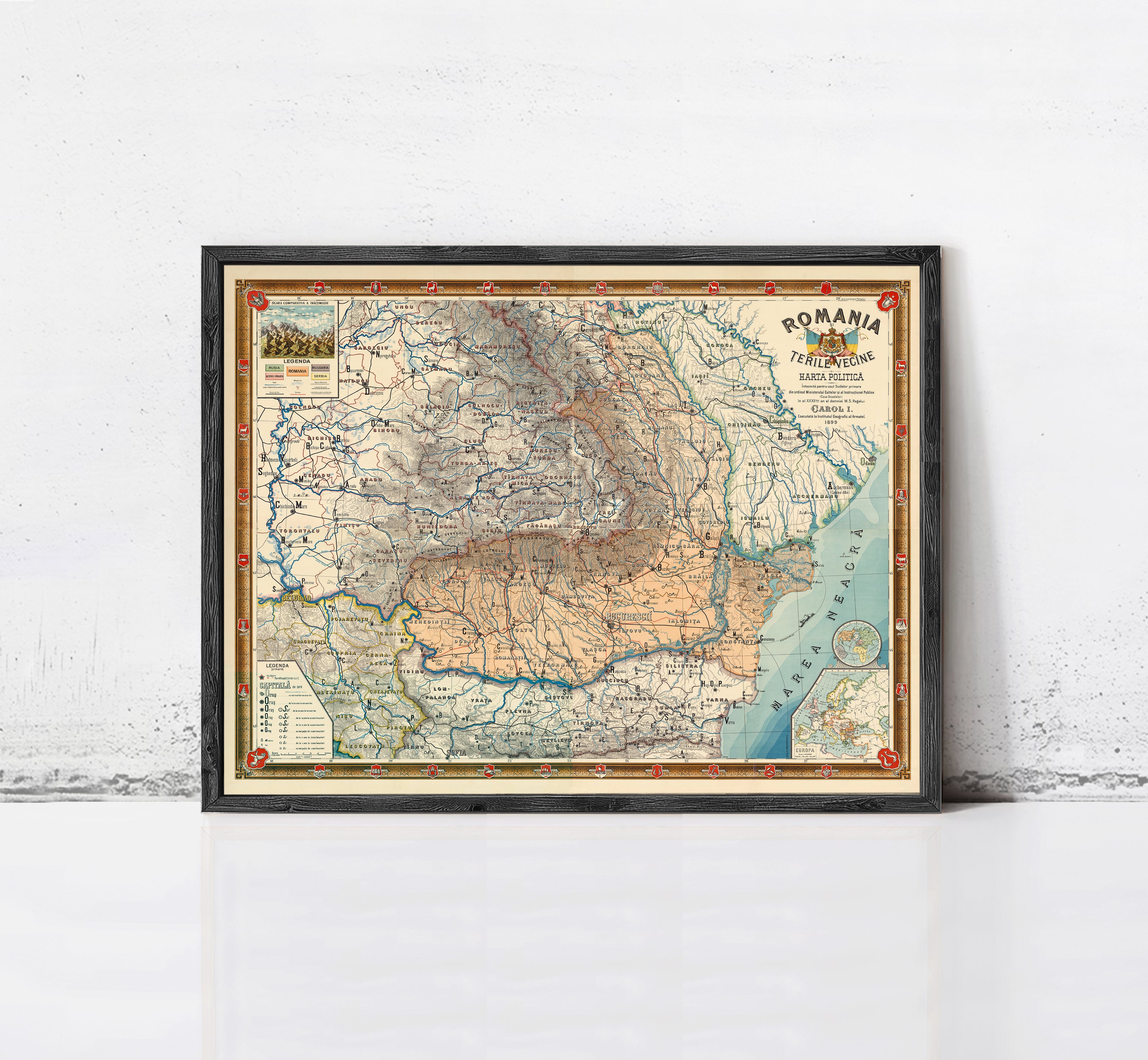 The image is a framed map of Romania, depicting the country's geographical layout and various regions.