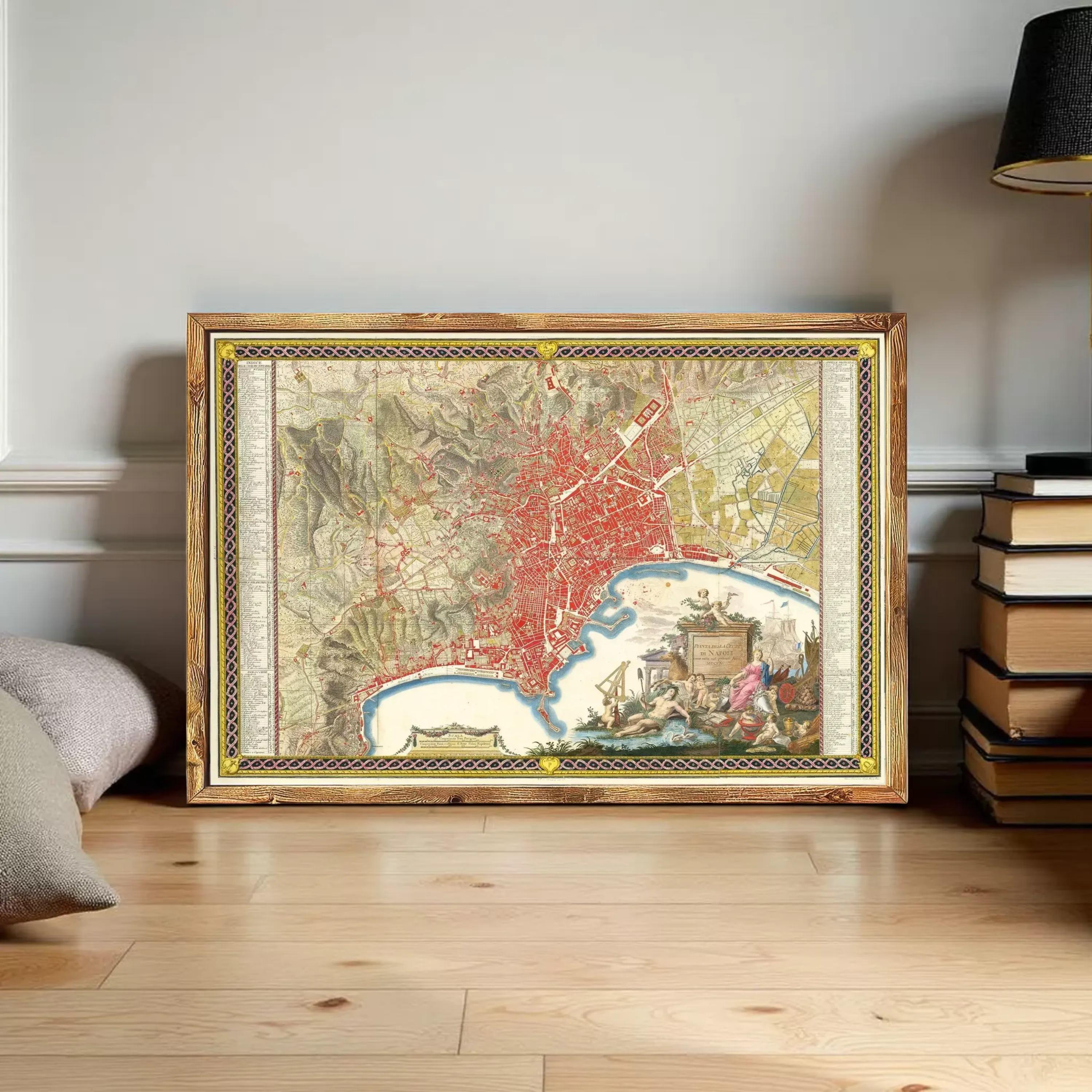 A framed map of a city is displayed on a wooden floor, surrounded by books and other items.