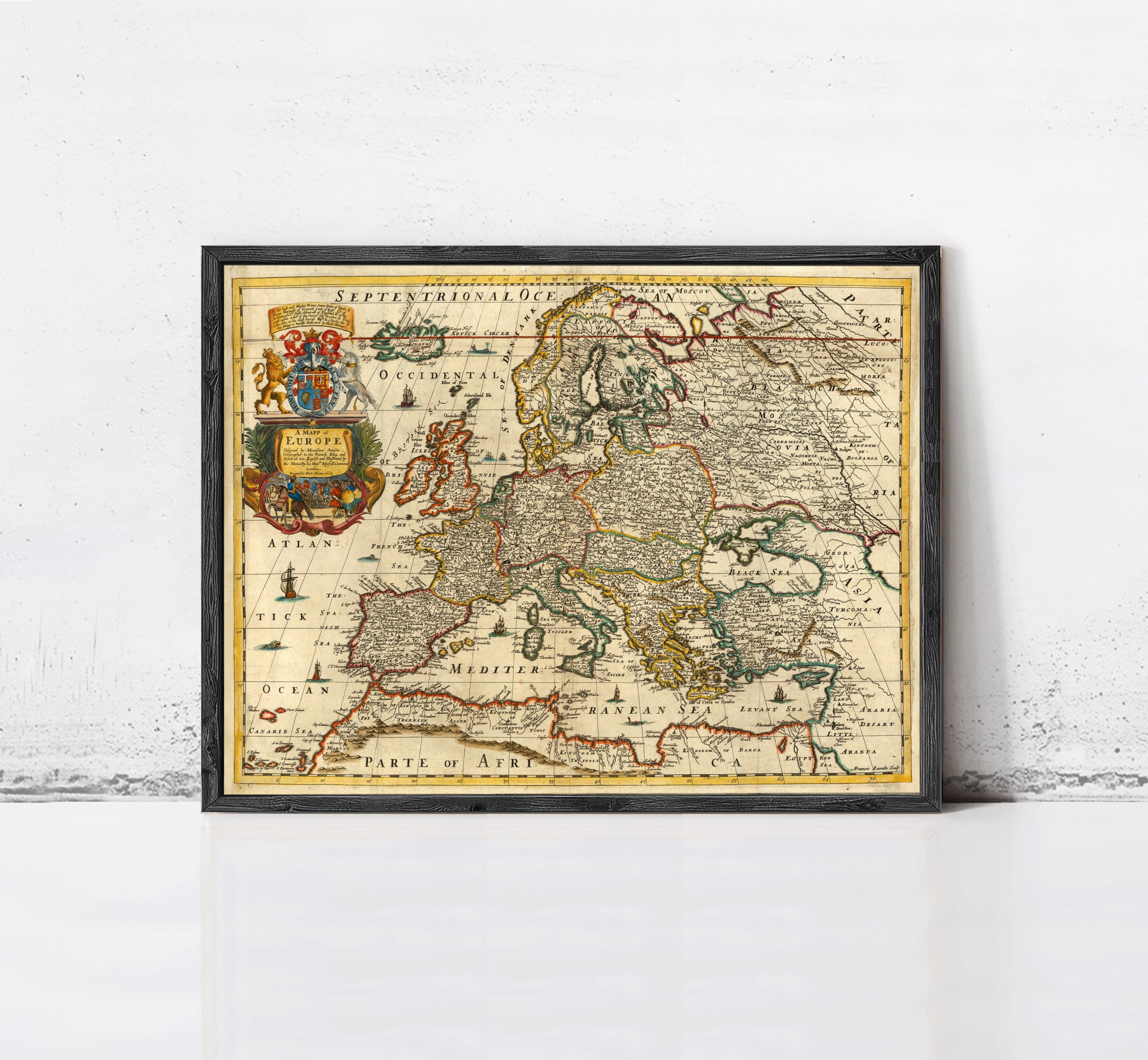 The image is a framed vintage map of Europe, depicting the continent and surrounding seas.