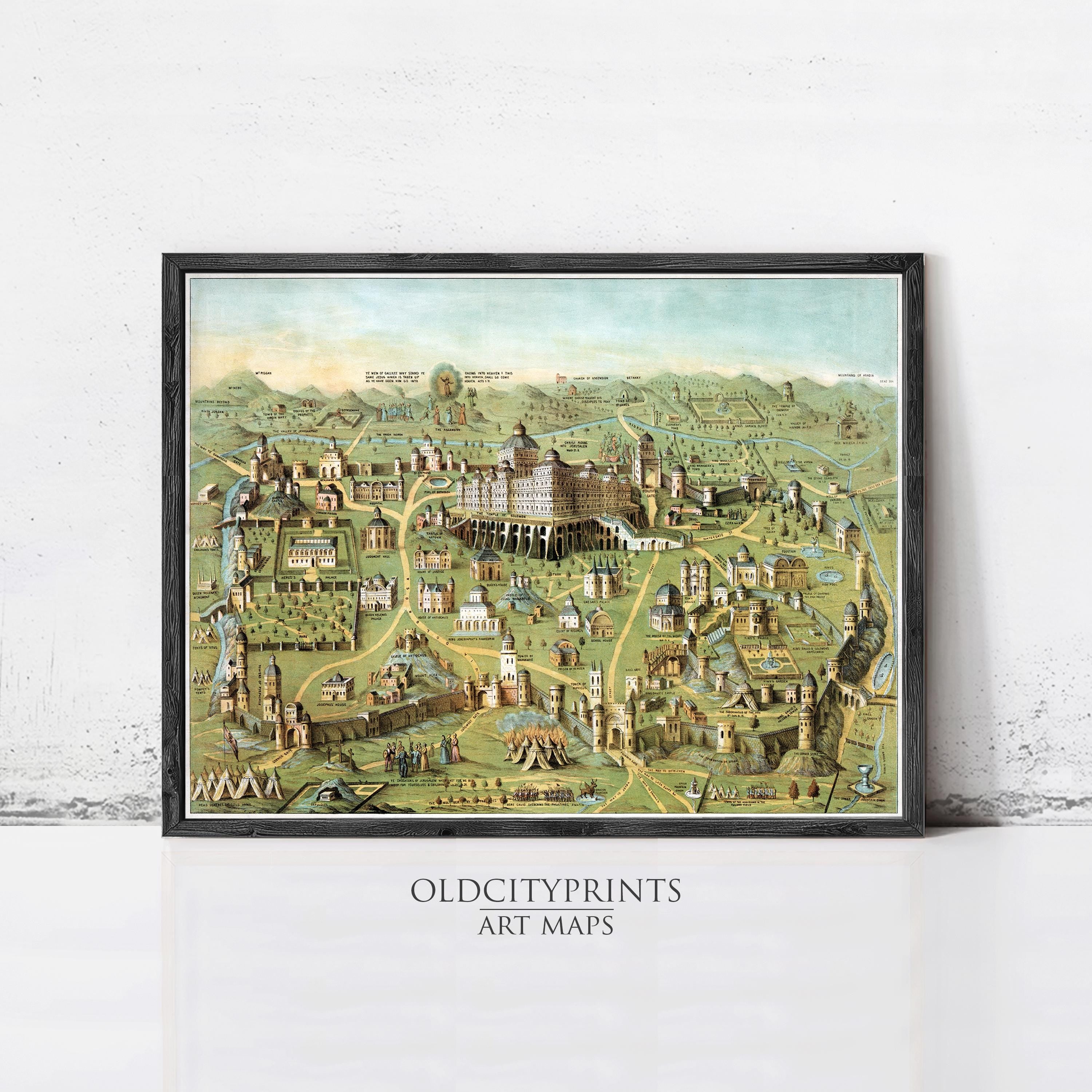 The image is a framed art print depicting a detailed map of a city, with various landmarks and buildings represented in a colorful and intricate manner.