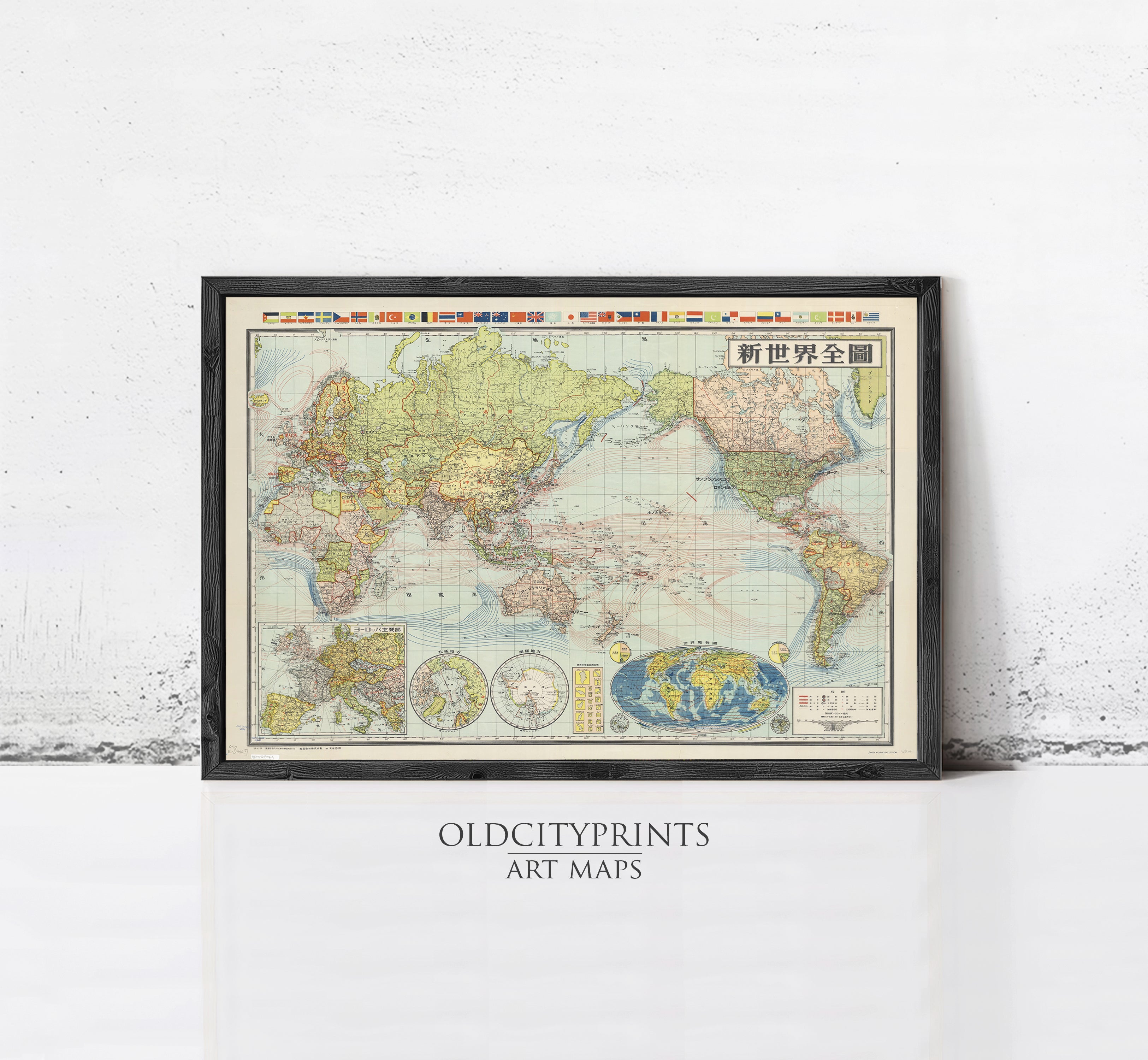 A framed vintage world map with various country borders and labels, displayed on a white wall.