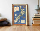 The image is a framed vintage map of New Zealand, depicting the country's geographical features and landmarks.