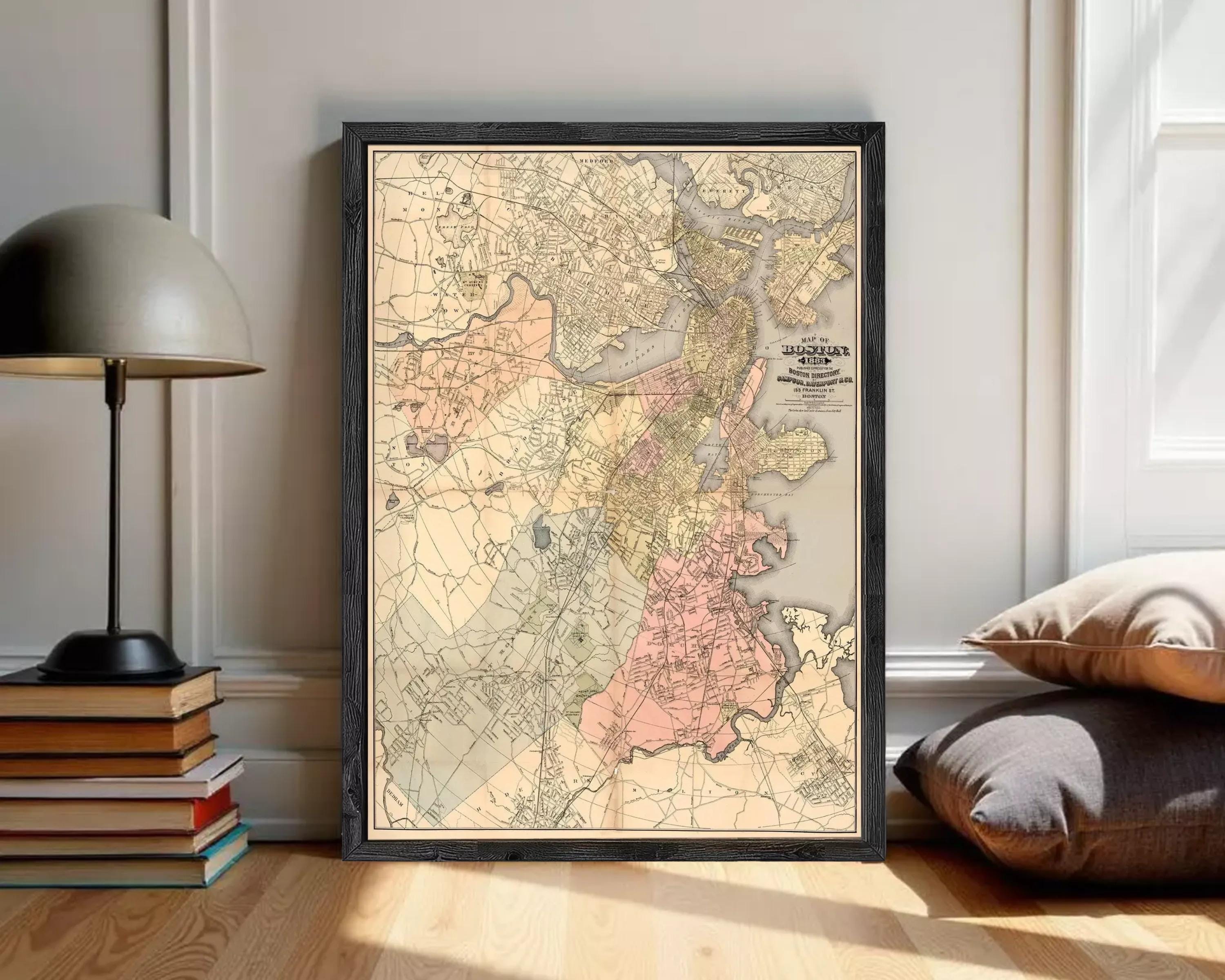 The image is a framed vintage map of Boston, Massachusetts, with a black border and a beige background.