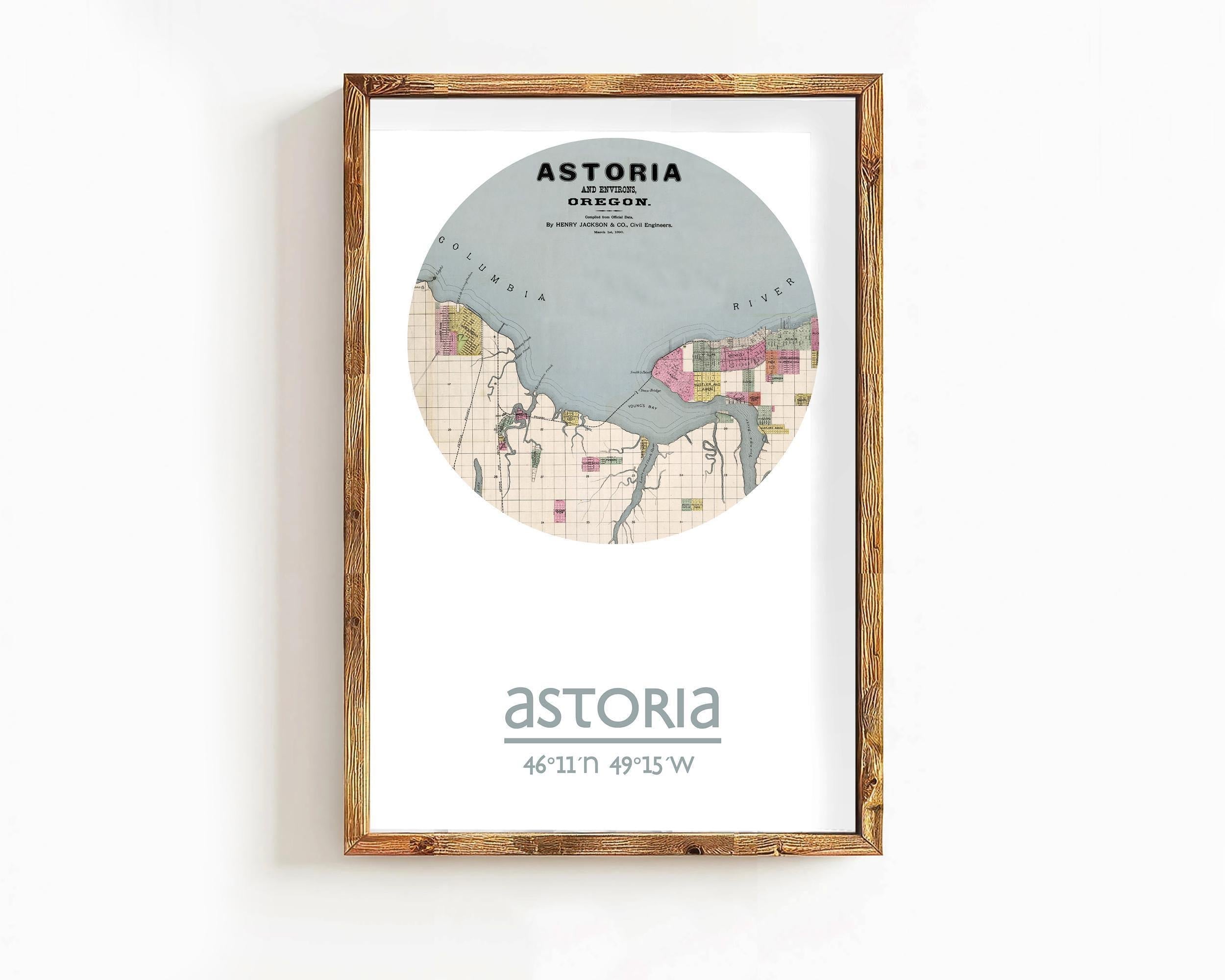 The image is a framed map of Astoria, Oregon, with a wooden frame.