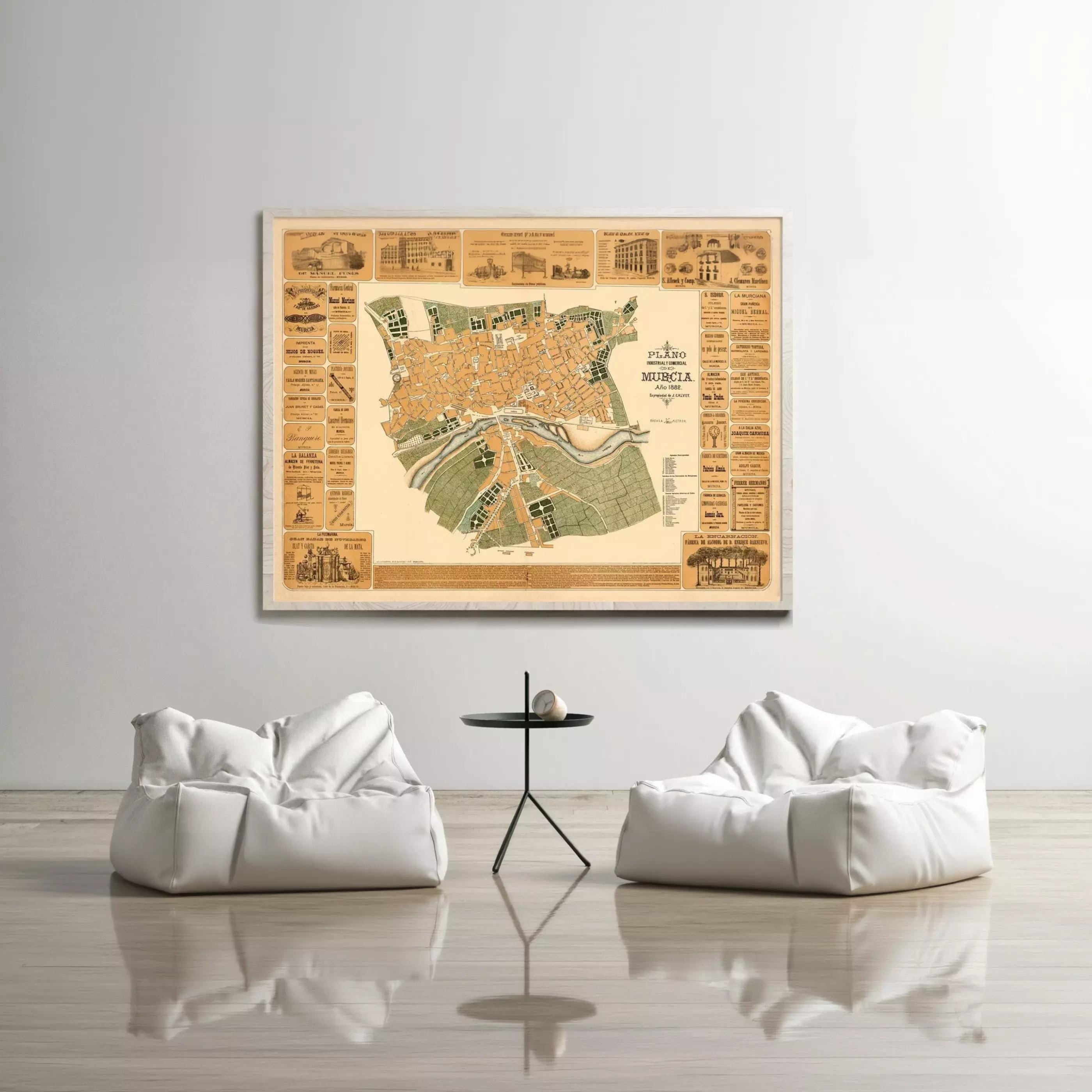 a large map of a city displayed on a wall, with two white bean bag chairs positioned in front of it.