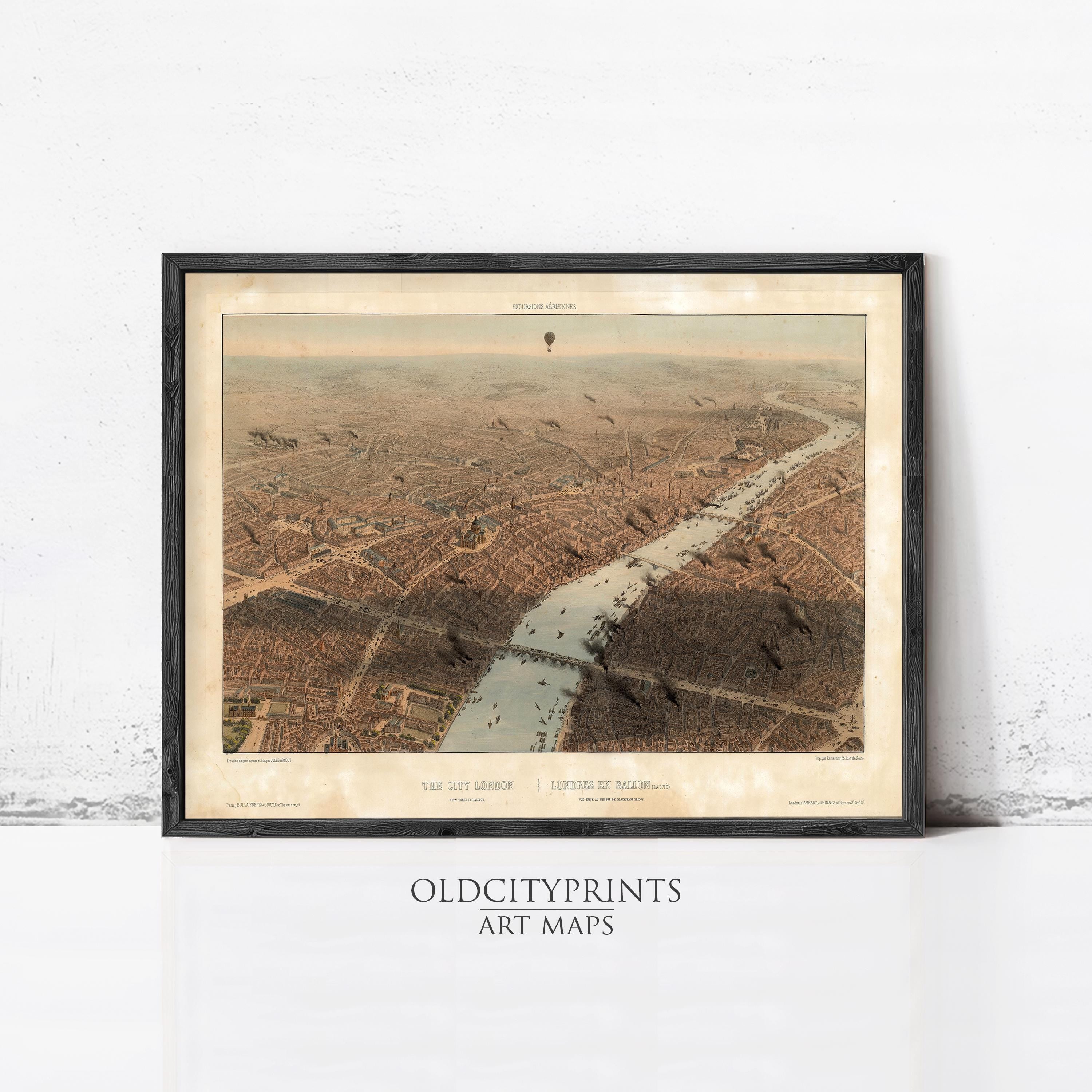 The image is a framed art print depicting an aerial view of a city, with a river or canal running through the center.
