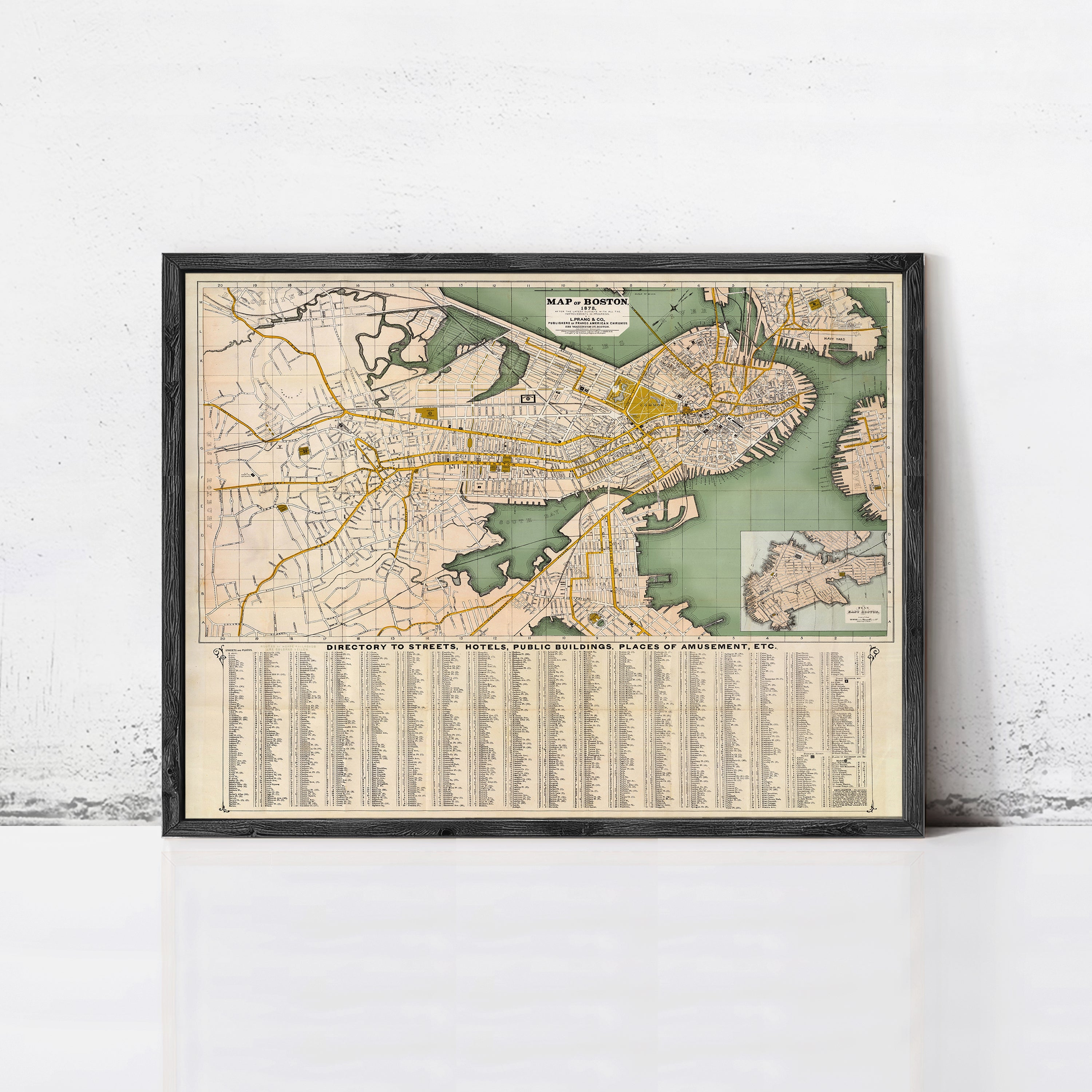 The image is a framed vintage map of Boston, Massachusetts, showing streets, landmarks, and a legend.