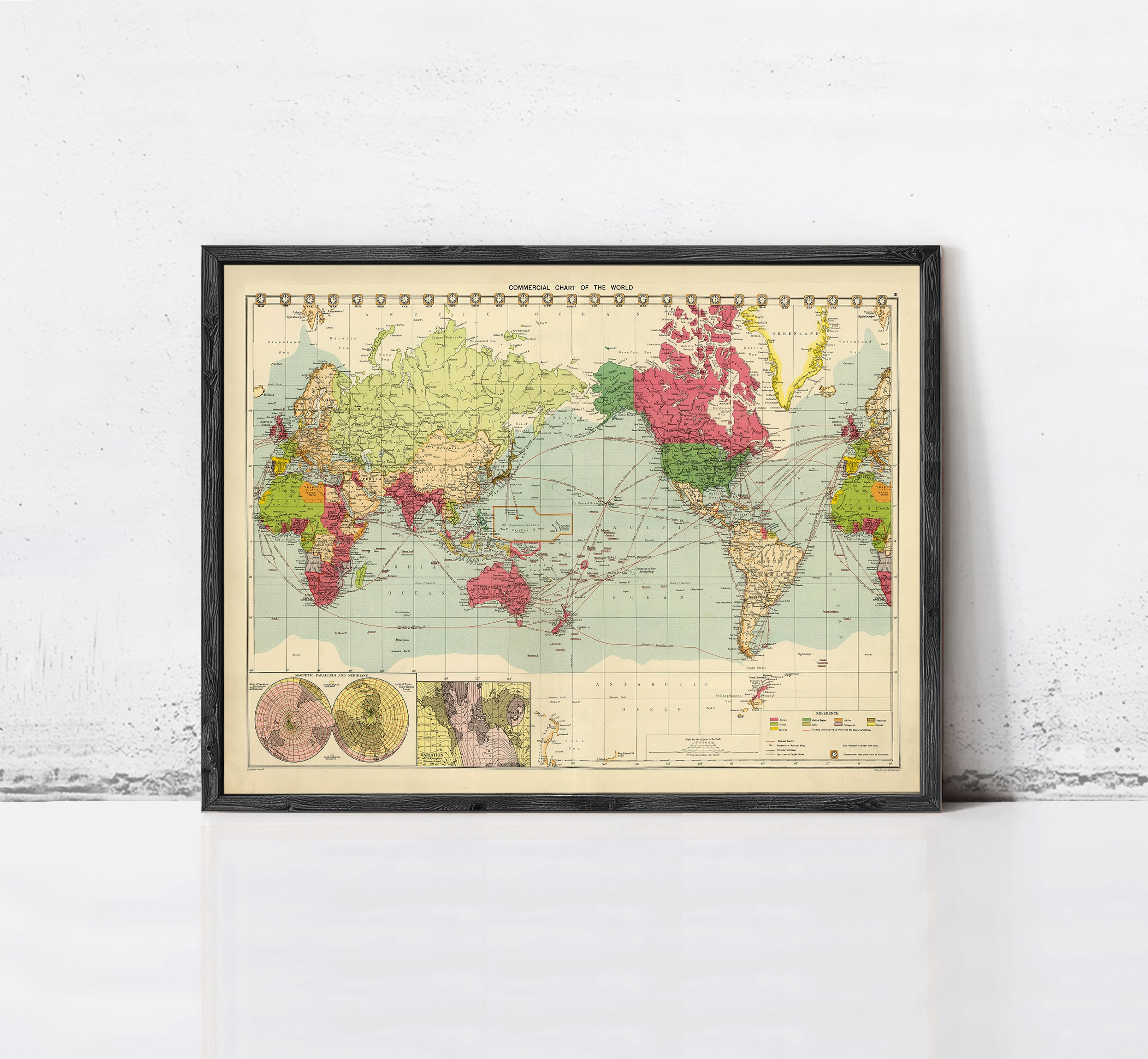 The image is a framed vintage world map with colorful landmasses and a grid system.