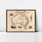 The image is a framed vintage map of Australia, featuring various illustrations and labels.