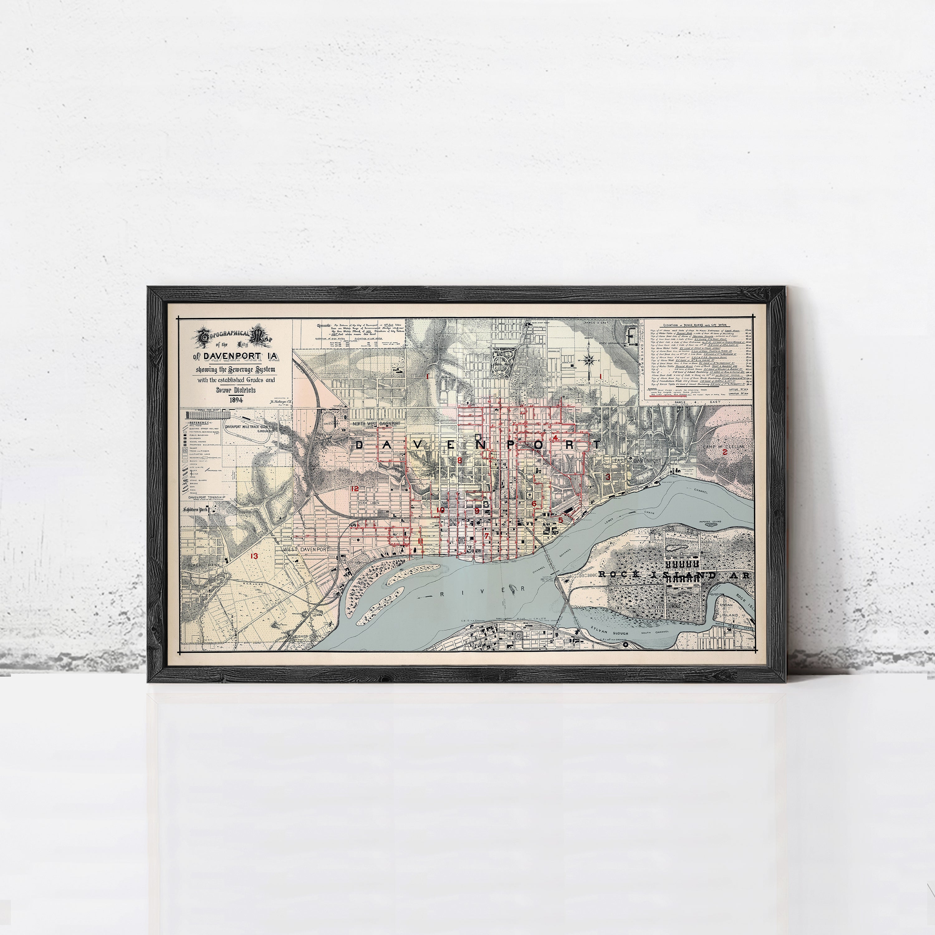 The image is a framed vintage map of the city of Baltimore, Maryland, with various streets and landmarks depicted.
