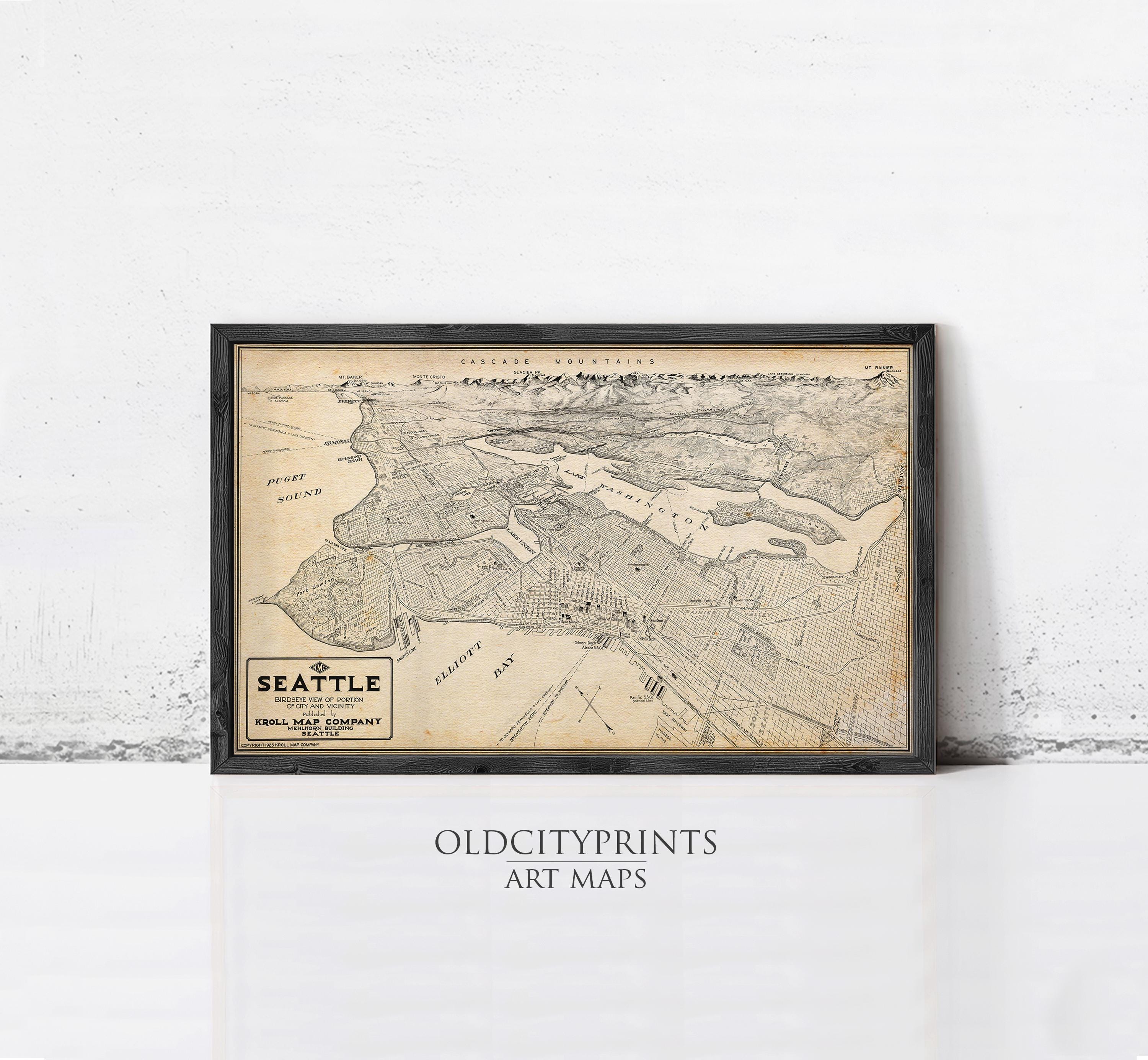 The image is a framed vintage map of Seattle, Washington, with the text "SEATTLE" and "KROLL META COMPANY" printed on it.