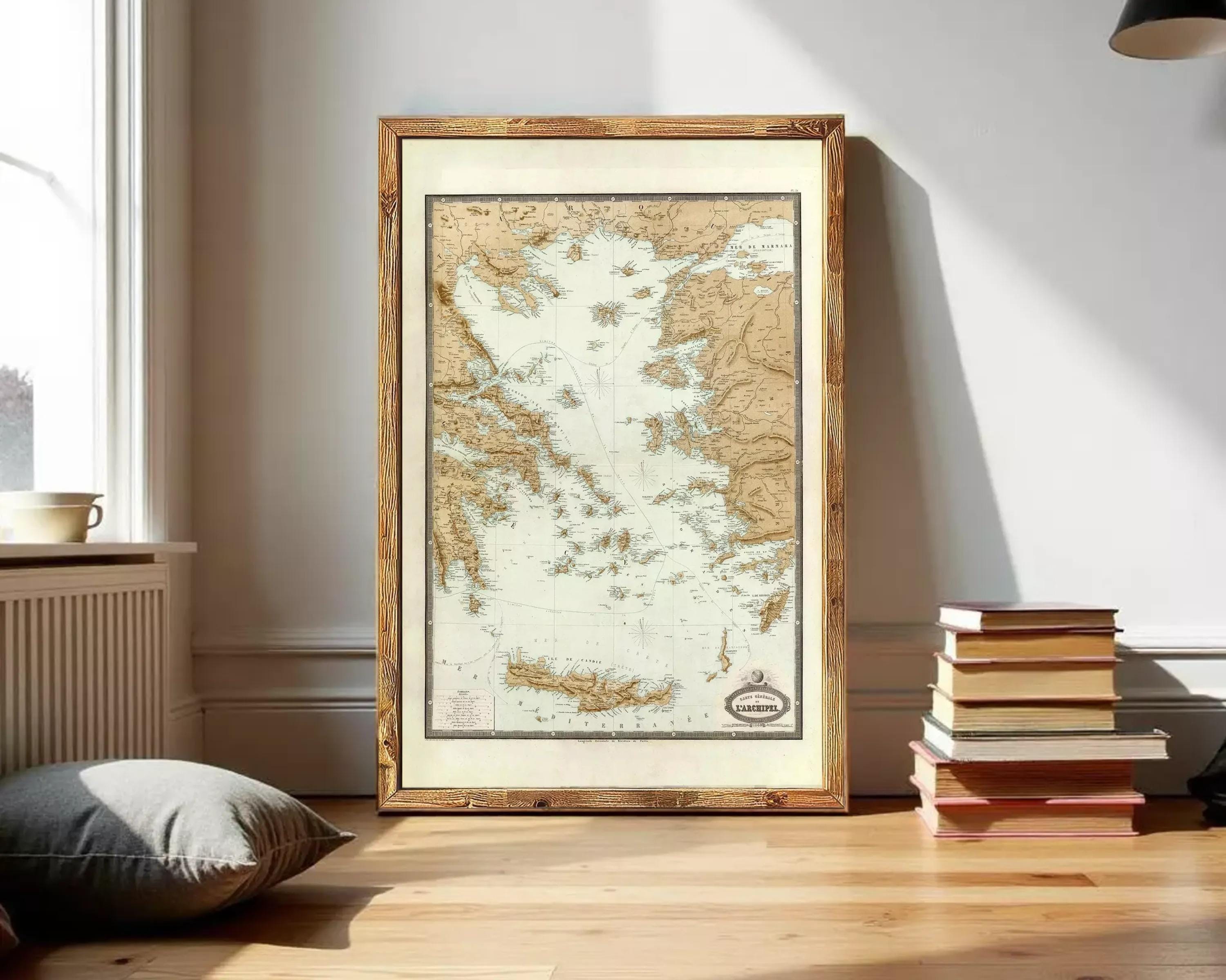a framed map of Greece, with a wooden frame and a white background.