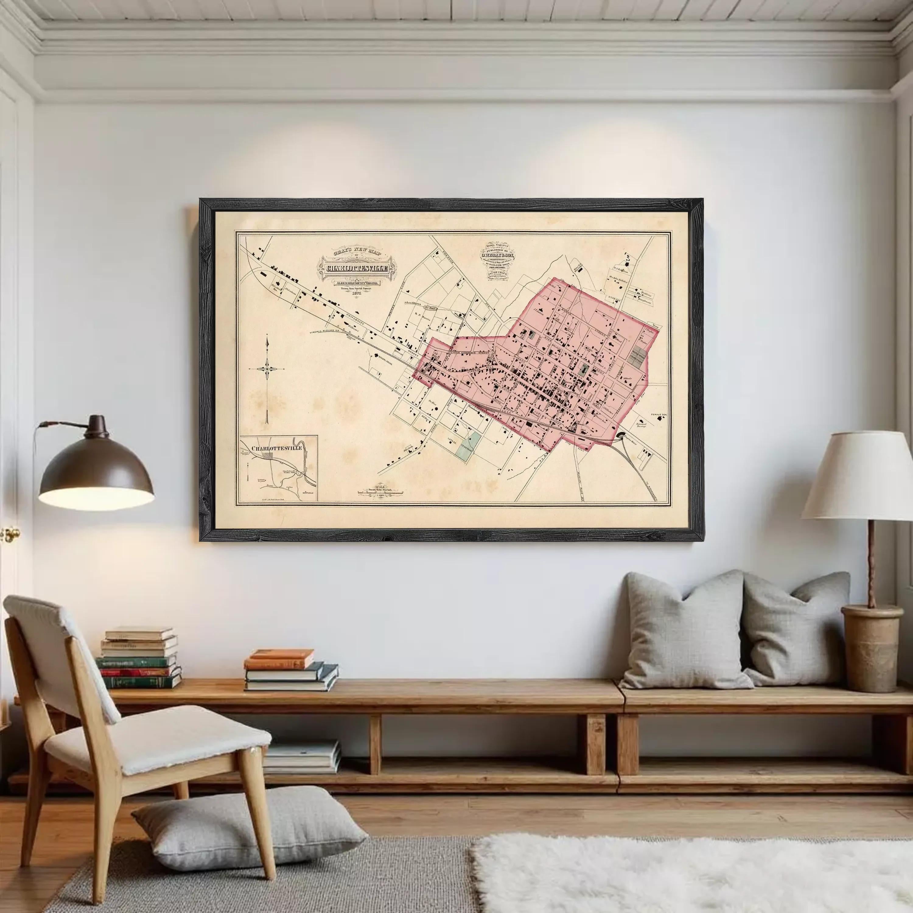 The image is a framed vintage map of a city, depicting a detailed layout of streets, buildings, and other urban features.