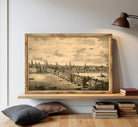 A framed black and white illustration depicting a cityscape with a river and boats, set against a cloudy sky.