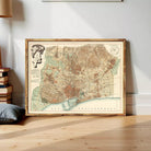 The image is a framed vintage map of a city, likely Barcelona, Spain, with a detailed and intricate design.