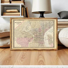The image is a framed vintage map of Philadelphia, Pennsylvania, showing the city's streets and surrounding areas.