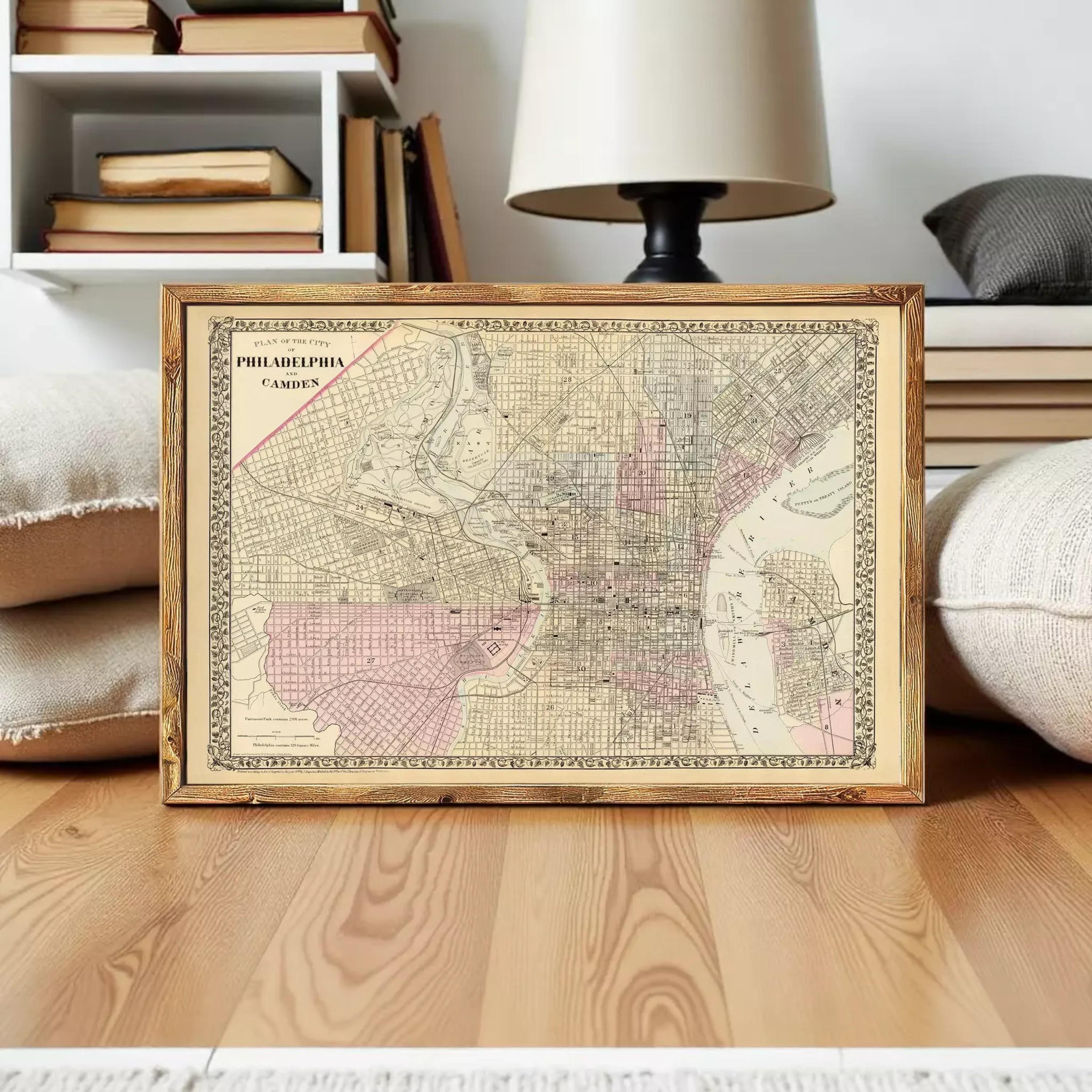 The image is a framed vintage map of Philadelphia, Pennsylvania, showing the city's streets and surrounding areas.