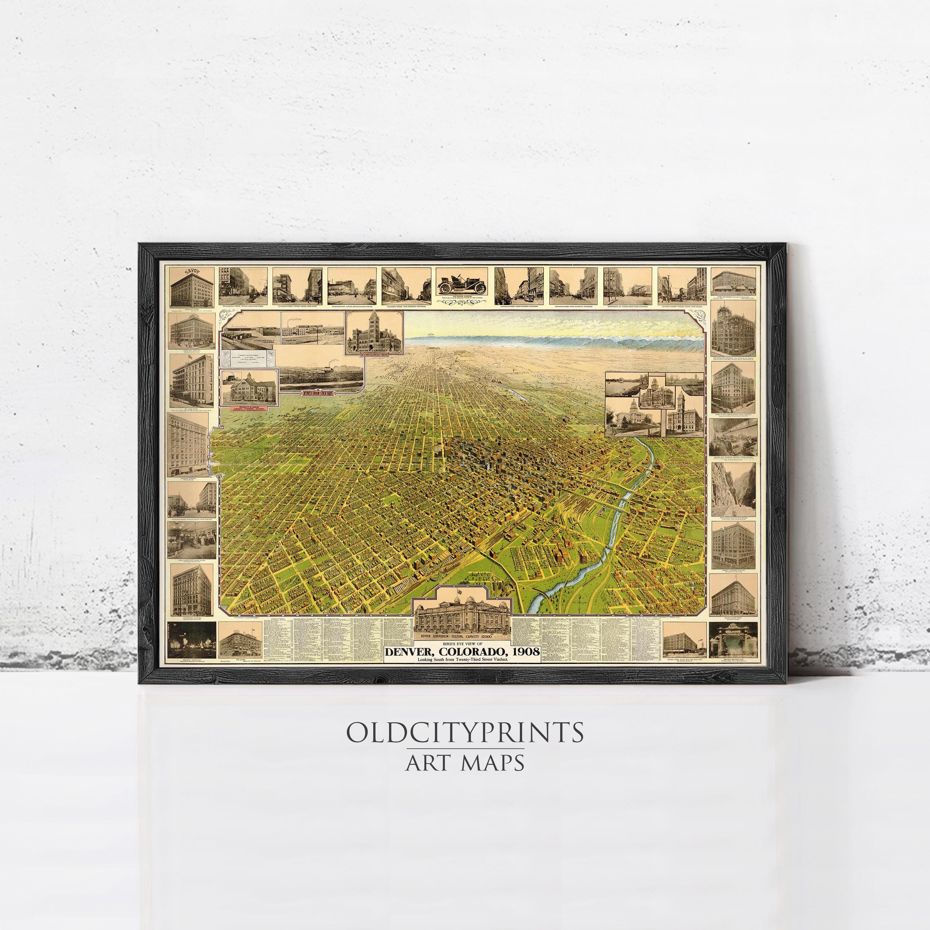 The image is a framed art map of Denver, Colorado, from 1958, depicting various buildings and landmarks in the city.