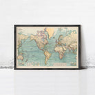 The image is a framed vintage map of the world, depicting the continents and oceans in a detailed and colorful manner.