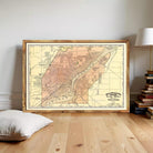 The image is a framed vintage map of a city, likely Toledo, Ohio, with a wooden border.