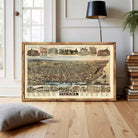 The image is a framed vintage map of Tacoma, Washington, depicting various buildings and landmarks across the city.