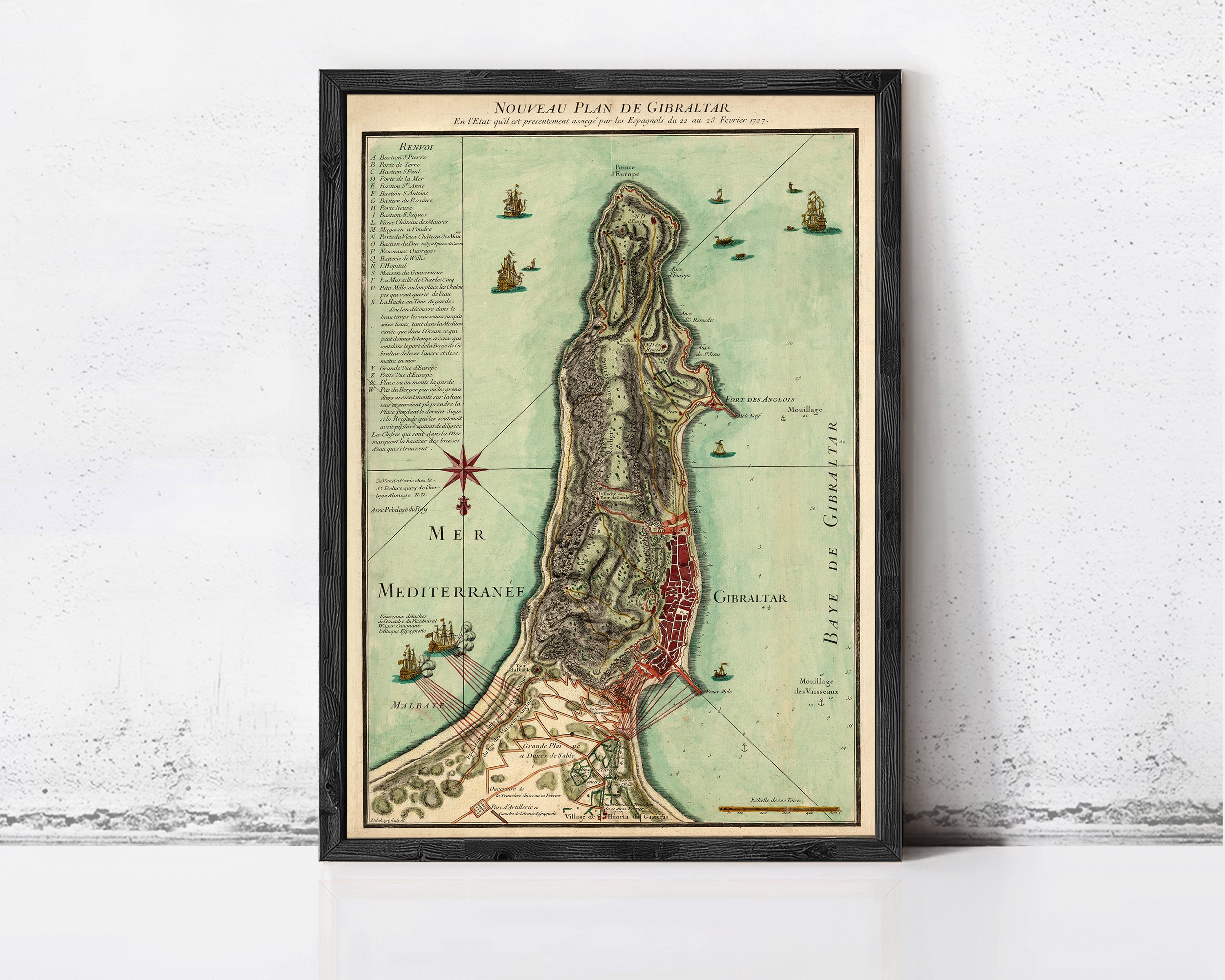 The image is a framed map of the island of Gibraltar, showing the surrounding areas and the coastline.