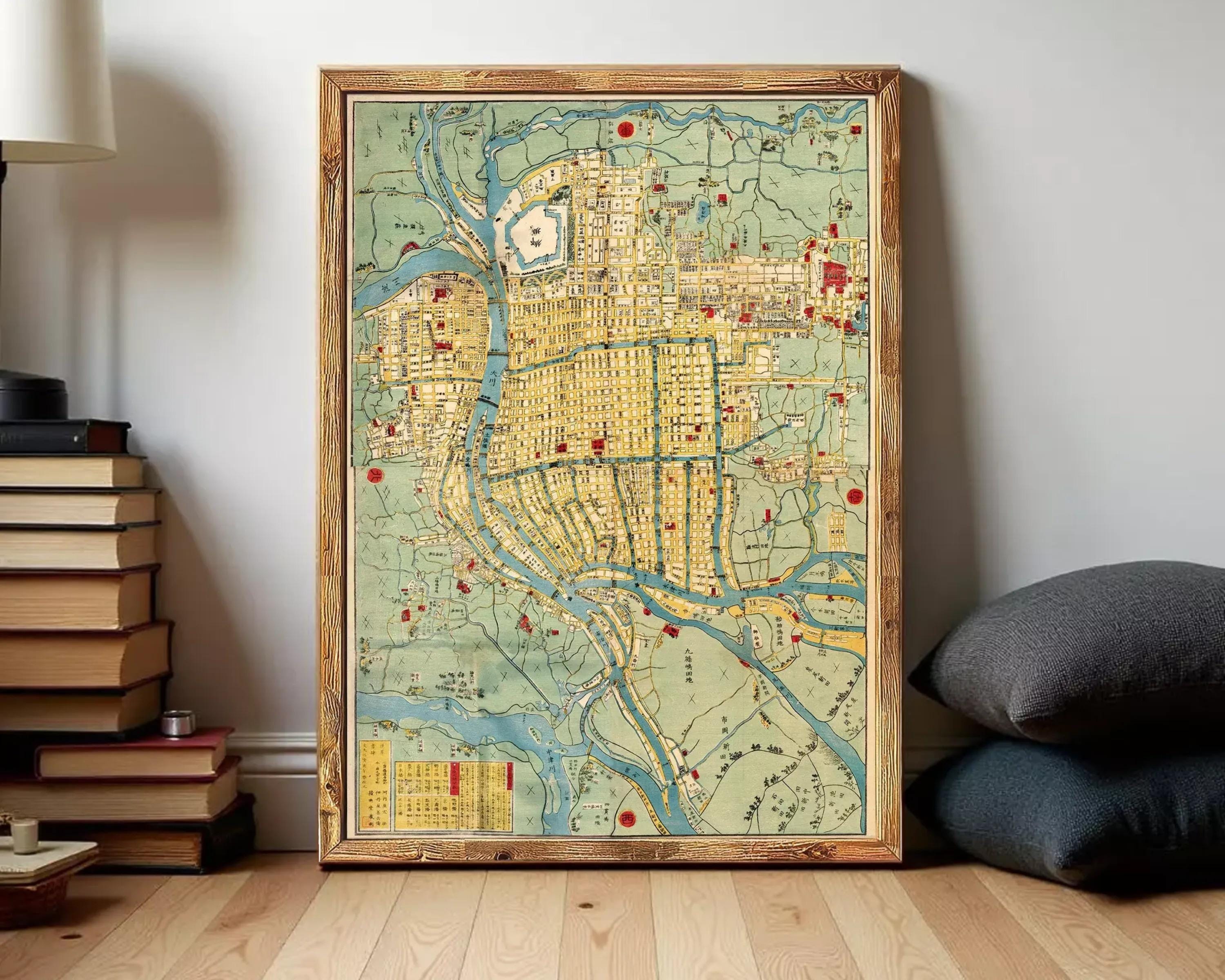 The image is a framed map of a city, likely from the 19th century, with various landmarks and streets depicted in a vintage style.