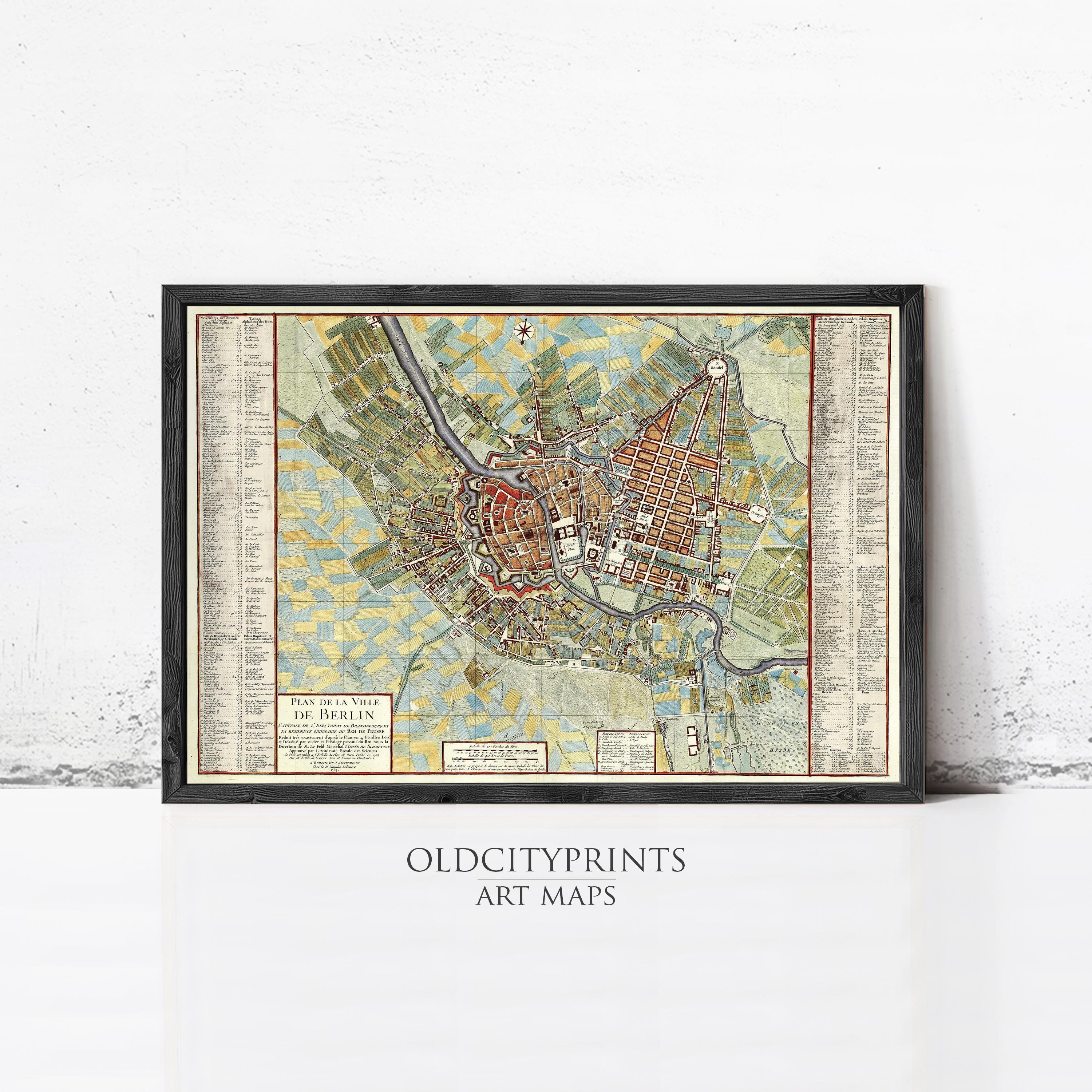 The image is a framed vintage map of a city, likely from the 16th century, with detailed labels and a color scheme of green, yellow, and red.