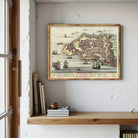 The image is a framed vintage map of a coastal city, depicting various ships and boats in the surrounding waters.