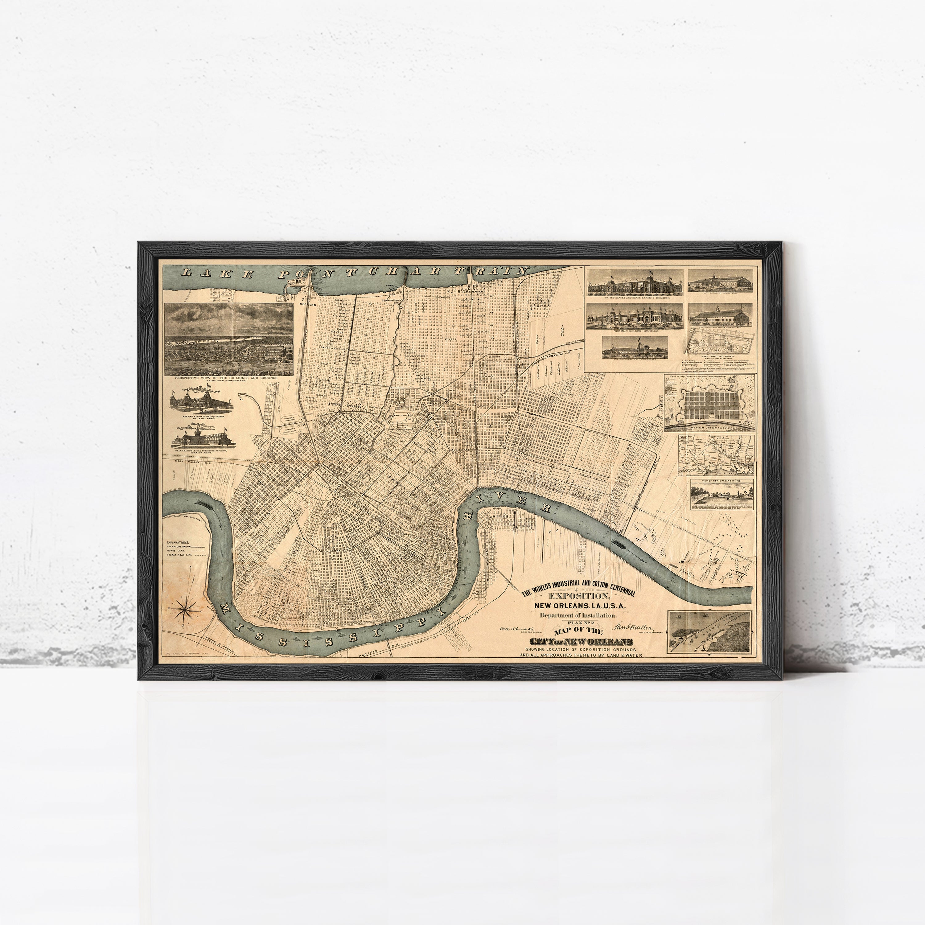 The image is a framed vintage map of a city, likely New Orleans, Louisiana, with a river running through the center.