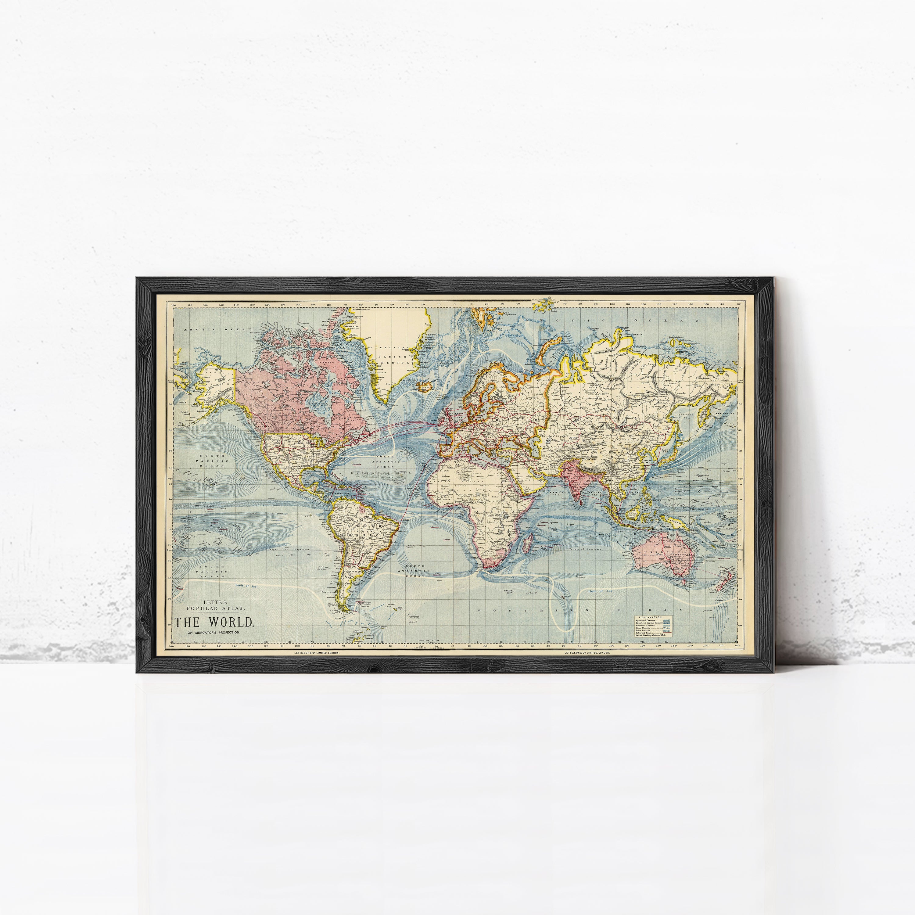 The image is a framed vintage world map depicting the continents and oceans.
