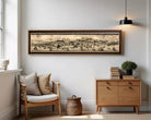 a cozy living room with a large framed map hanging on the wall, a wooden chair, a wooden dresser, and a small basket on the floor.