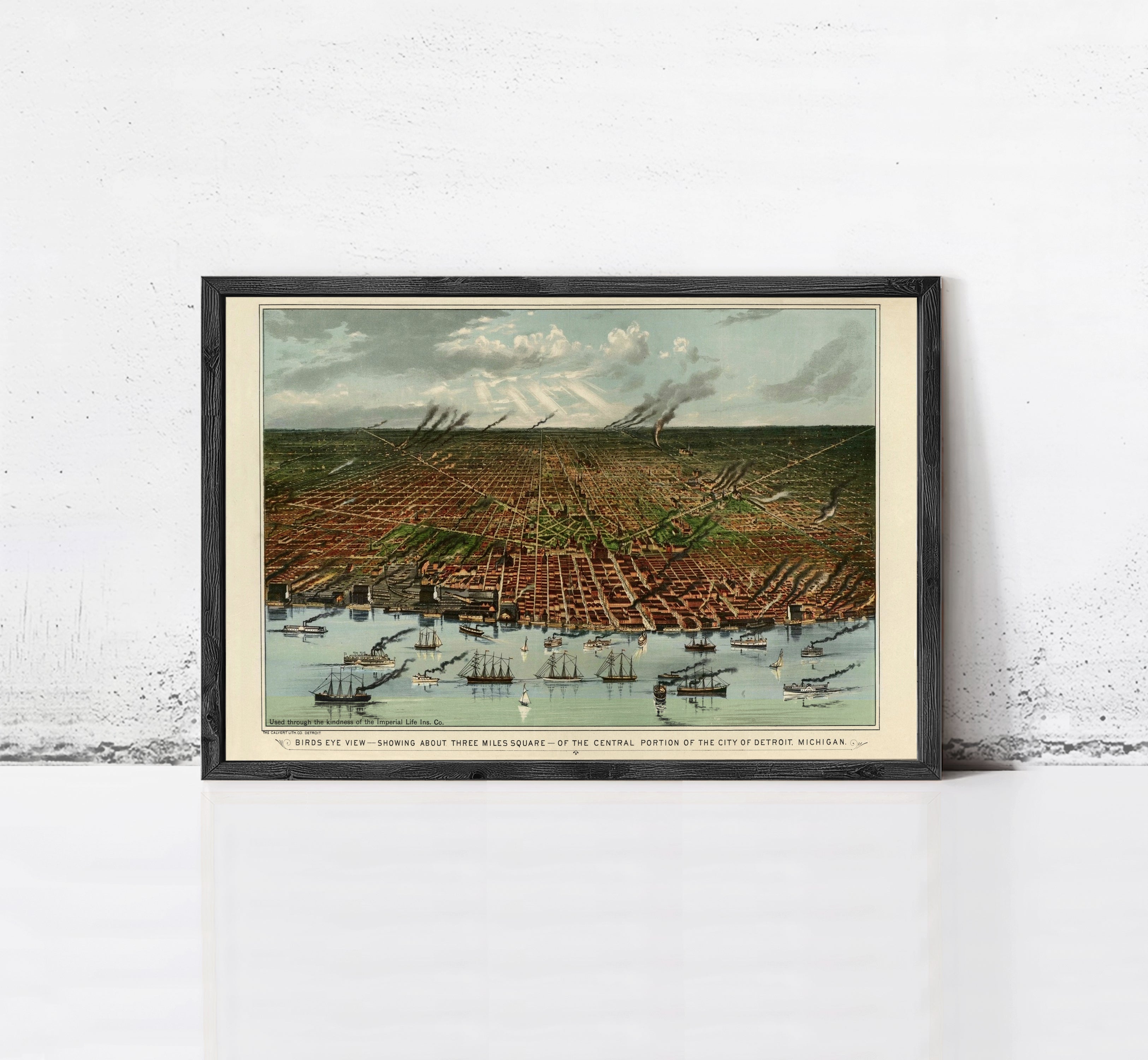 The image is a framed painting depicting a cityscape with boats in the water, set against a cloudy sky.