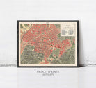 The image is a framed vintage map of the city of Atenas, depicting the streets, buildings, and other urban features in a detailed and colorful manner.