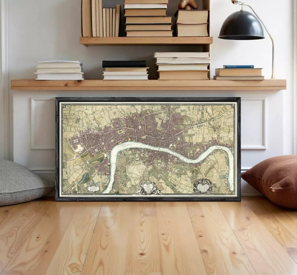 A framed map of London, England, with a river running through the city.