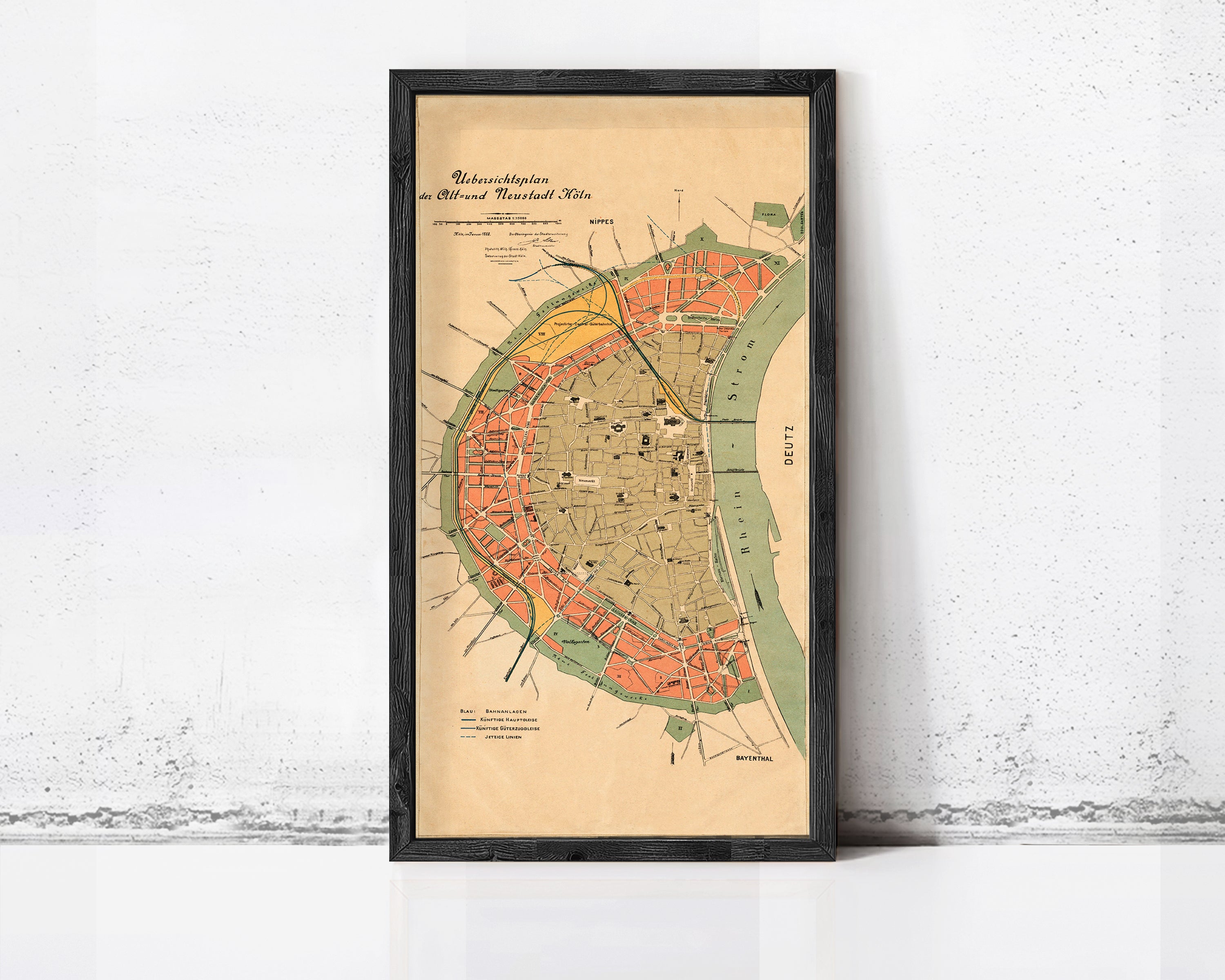 The image is a framed vintage map of a city, likely from the 19th century, with a focus on the city's layout and surrounding areas.
