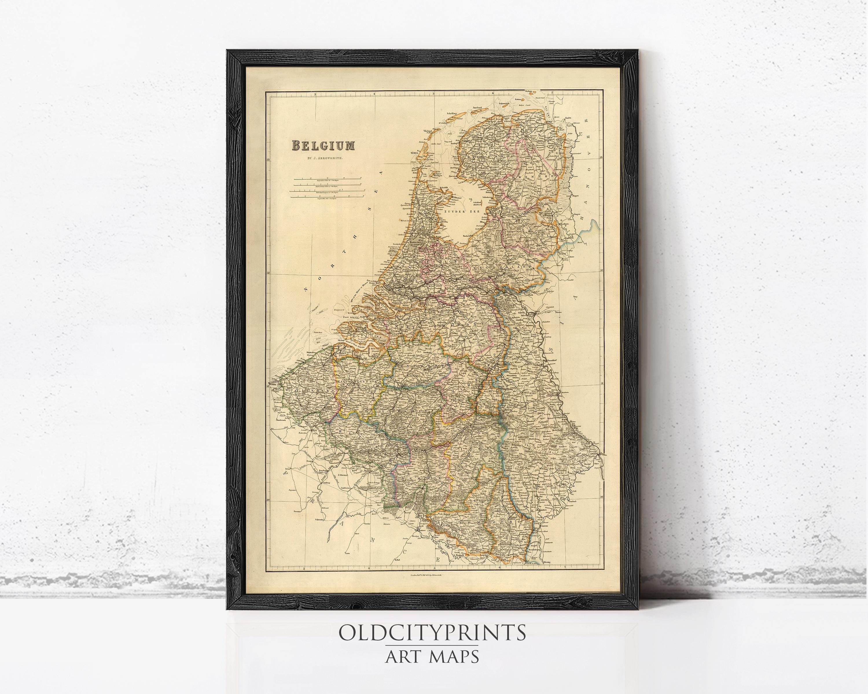 The image is a framed antique map of Belgium, depicting the country's geographical layout and surrounding areas.